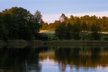 lake shore with  fog at sunset