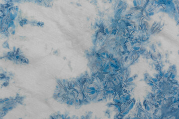 The fabric indigo tie dye as a background and texture.