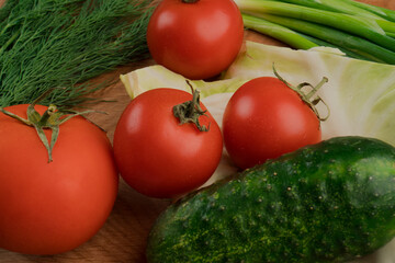 Still life, salad products on a wooden board