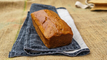 Gluten-free whole grain rye bread on the sackcloth background. Healthy food concept..