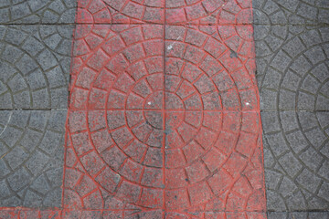 Fototapeta na wymiar Gray and red catwalk outdoor tile
