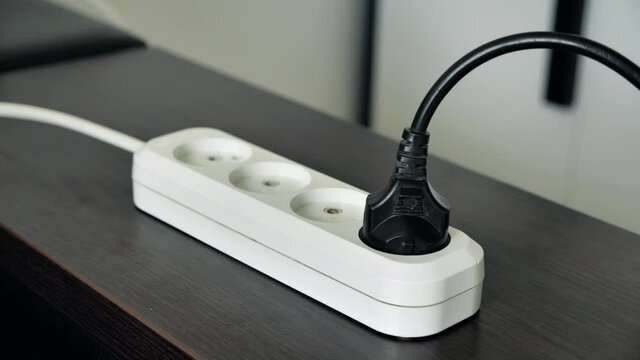 Smartphone charging with USB charger connection in female hand. 4K.