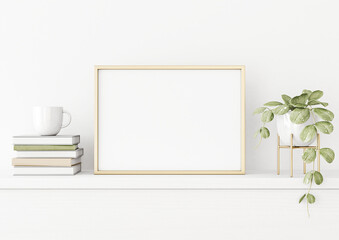 Fototapeta na wymiar Poster mockup with horizontal gold metal frame on the table with green plant in pot, books, cup and trendy interior decoration on empty white wall background. A4, A3 size. 3D rendering, illustration.