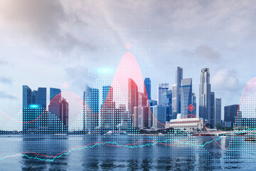 Forex and stock market chart hologram over panorama city view of Singapore, the financial center in Asia. The concept of international trading. Double exposure.