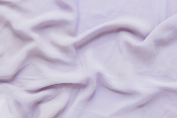 Texture of silk fabric, soft pastel purple. Beautiful soft crumpled silk texture