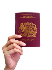 A Woman holding a British National Oversea (BNO) Passport 