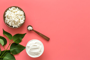 Cottage cheese in bowl with spoon - for breakfast - top view copy space