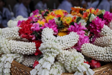 The jasmine garlands on the tray with pedestal, and the tradition of Thailand to celebrate Mother's Day in Thailand.
