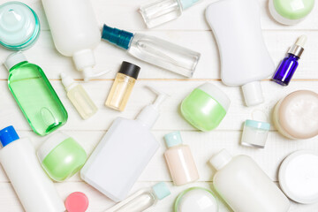 Group of plastic bodycare bottle Flat lay composition with cosmetic products on wooden background empty space for you design. Set of White Cosmetic containers, top view with copy space