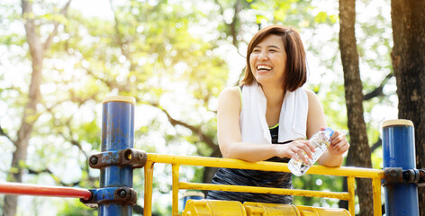 Lifestyle Happy Asian women is smiling in the great outdoors or the beautiful nature park. Enjoying...