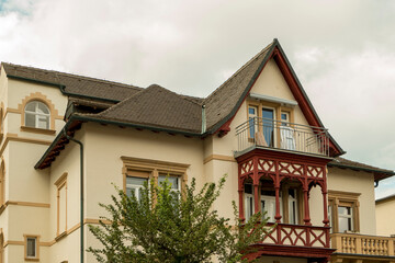 historical house facade with wooden balcony and window