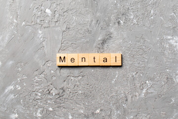 mental word written on wood block. mental text on cement table for your desing, concept