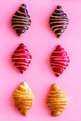 Croissants pattern - set of snacks on pink background