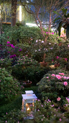 Fototapeta na wymiar Beautiful colorful blooming flower garden with lamp