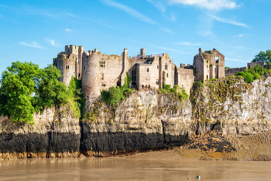 View across river to Chepstow Castle - the oldest surviving post-Roman stone fortification in Britain, found in 1067. Copy space in sky.