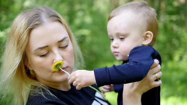 Mother and her litle boy. Happy Mother holding her sankissing and hugging. Maternity concept. Parenthood. Motherhood. Beautiful Happy Family.