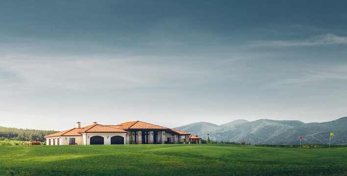 Golf Country Club On Background Of Mountains And Golf Course