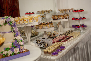 Sweet cakes at a wedding buffet. Catering