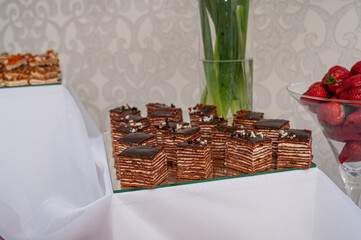 Sweet cakes at a wedding buffet. Catering