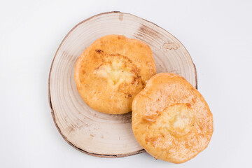 Delicious Georgian khachapuri - closed baked pie with homemade cheese isolated on white background
