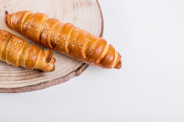 Baking a fresh bun filled with meat isolated on white background