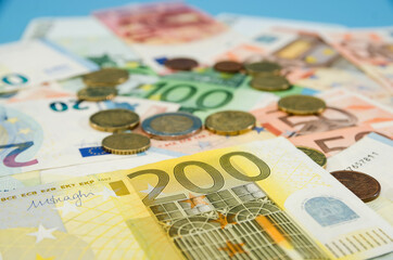 different euro banknotes and coins. Financial concept. Much money. Money background.