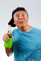 Funny looking man with bad teeth holding a beer - obrazy, fototapety, plakaty