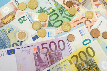 different euro banknotes and coins. Financial concept. Much money. Money background.