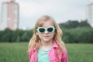 Portrait Of Smiling Girl In Sunglasses