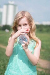 Close-Up Of five years old pretty Girl Drinking Water