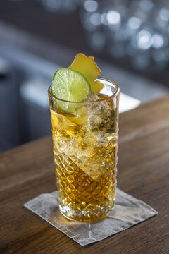 Whiskey Ginger Cocktail With Ice, Fresh Lime Served In A Bar