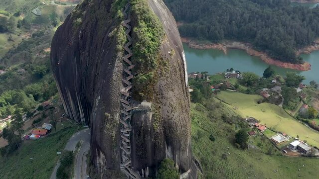 El Pe&ntilde;&oacute;n de Guatap&eacute; in Colombia aerial drone video. Orbiting shot over famous Piedra del Pe&ntilde;ol staircase with 649 steps leading to an amazing view over Guatap&eacute; lakes and islands.