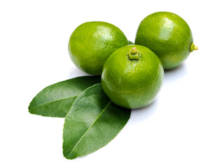 Fresh green lemons with leaves isolated on white background.