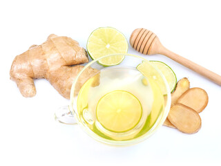 Healthy herbal drink in mug or tea with lemon ginger and honey.