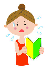 初心者マークを持つ若い困り顔の女性