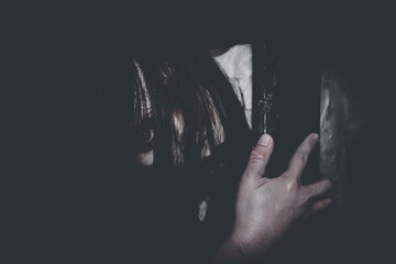Portrait of asian woman make up ghost face with blood,Horror scene,Scary background,Halloween...