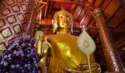 The 19 meter high gold-plated Buddha statue in the temple Wat Phanan Choeng Worawihan