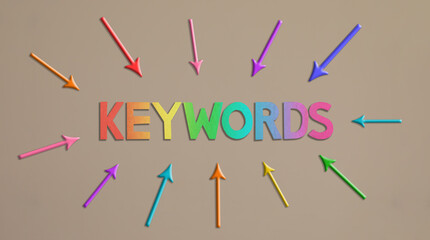Text KEYWORDS made of color cardboard on light background