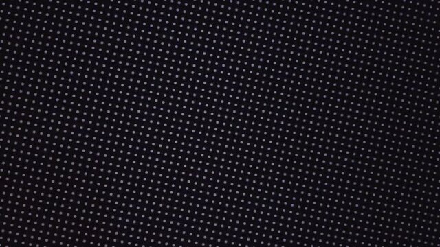 Close-up of the LCD screen pixels. Abstract background. Close the color-coded LED display. RGB pixels on a TV while a movie is being shown. Red, blue and green subpixels create an image on the screen