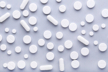 Medicine pills on grey background