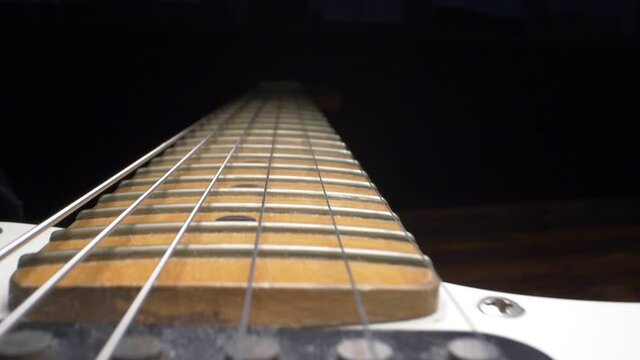 super close up. fretboard and electric guitar strings