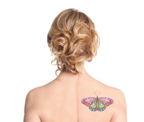 Young woman with colorful tattoo of butterfly on her body against white background, back view