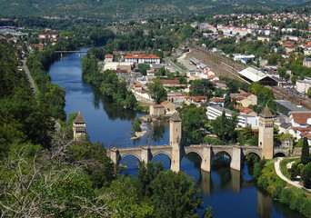 Fototapeta na wymiar View from the hill of the Lot River and the Gothic Valentre Bridge (14th century) . City of Cahors. France. 