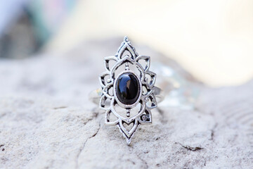 White metal silver ornamental ring with tourmaline mineral stone