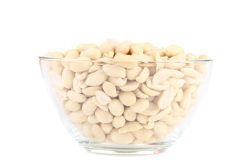 Peanuts in glass bowl isolated on white background