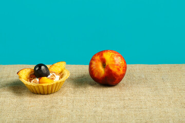 dessert with fruit with whipped cream and fruits on a blue background.