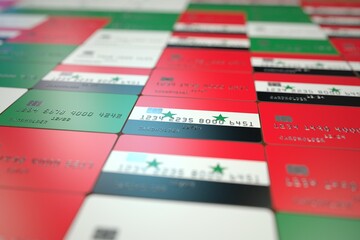 National flag of Syria on bank cards. Banking related 3D rendering