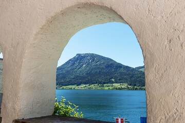 Wolfgangsee lake and mountains view from the window. Austria. Summer day
