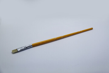 Brush refers to a tool consisting of bristles or threads attached to the end of a cable, a tool used to paint and clean