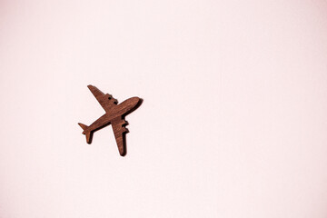 Wooden decorative plane weighs on white wall